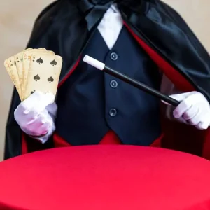 illusionist-holding-magic-wand-and-playing-card-2023-11-27-05-21-39-utc